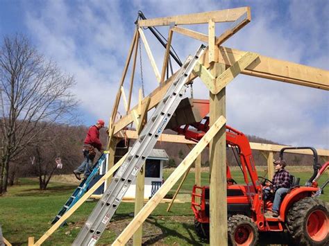 setting trusses with skid steer|raising trusses for farm tractors.